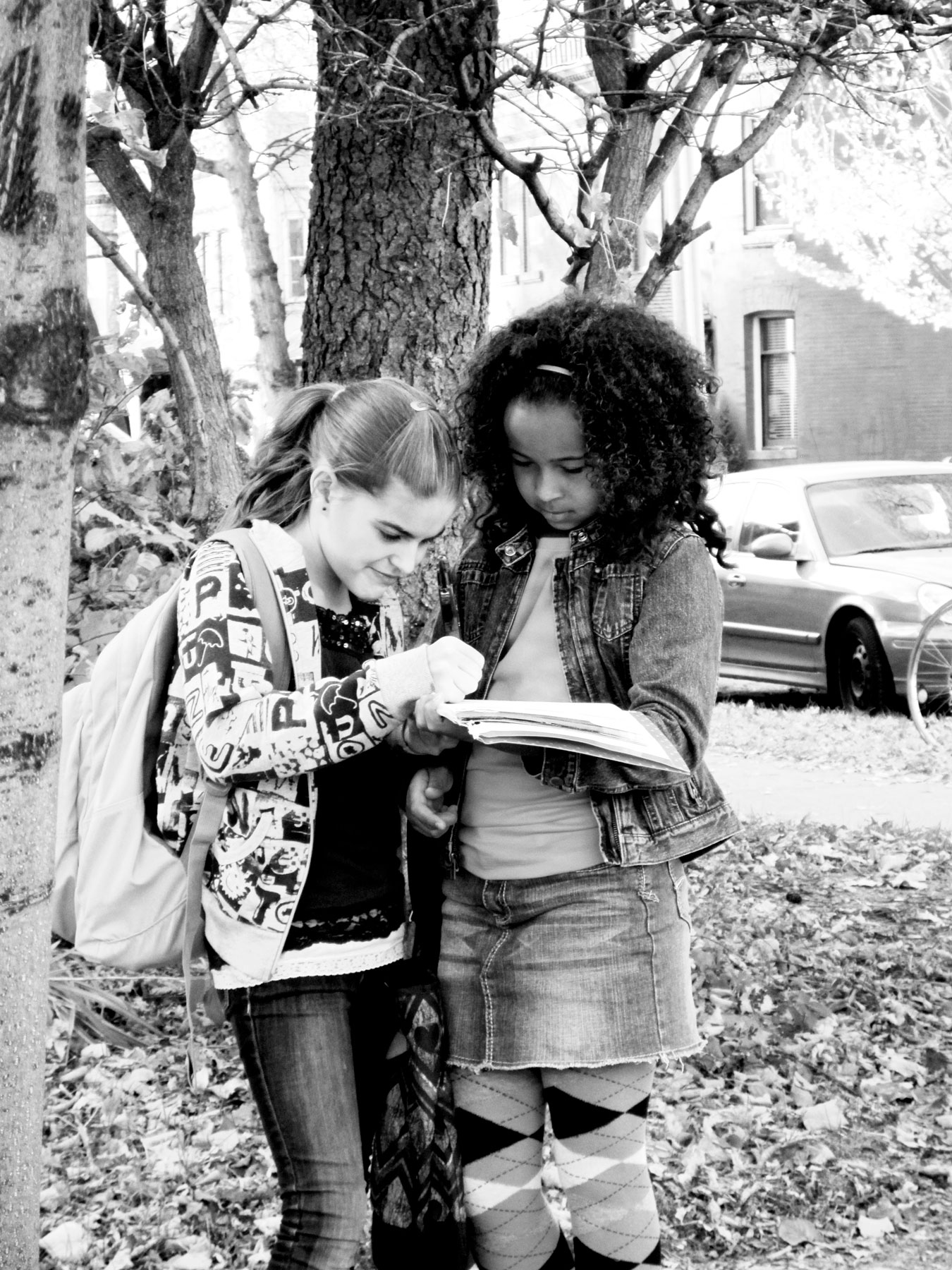 Two girls doing homework together